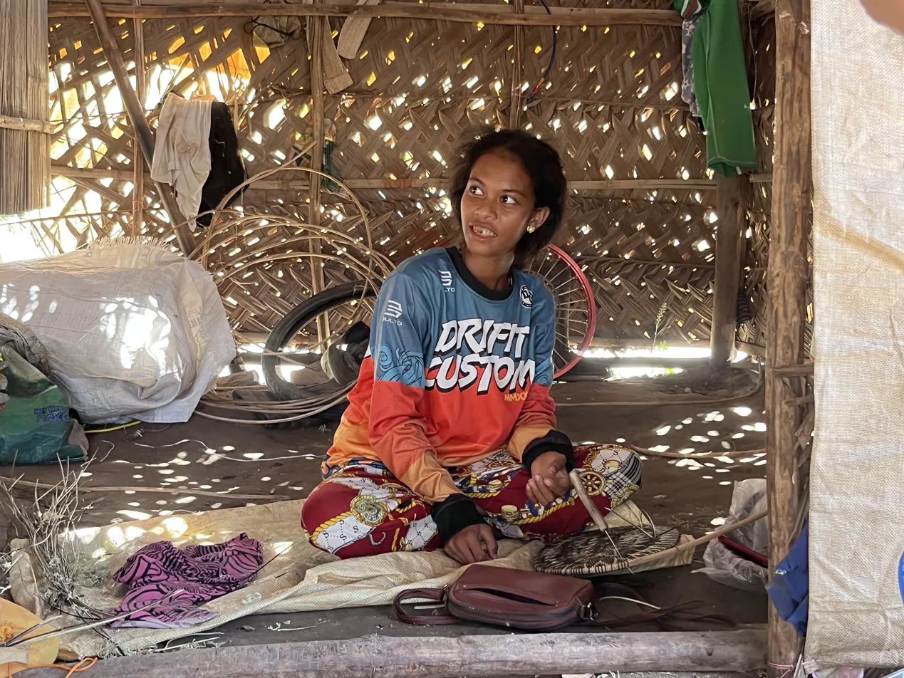 Mangyan artisan smiling in her home in Mindoro, Philippines